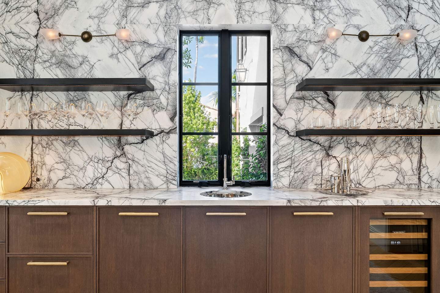 Wet bar with dramatic marble backsplash