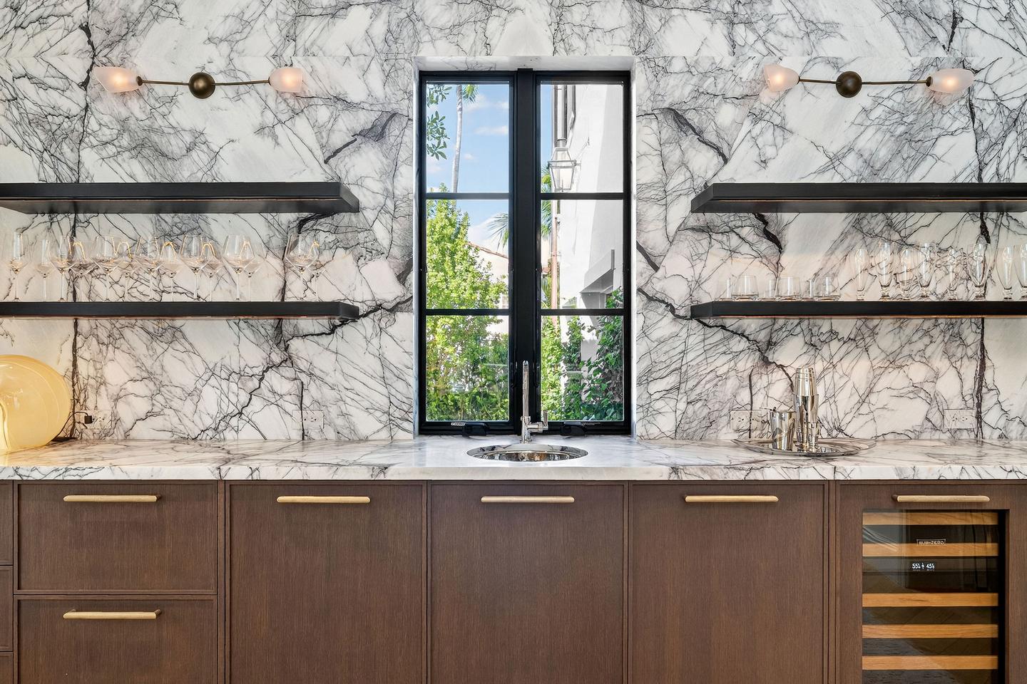 Wet bar with dramatic marble backsplash
