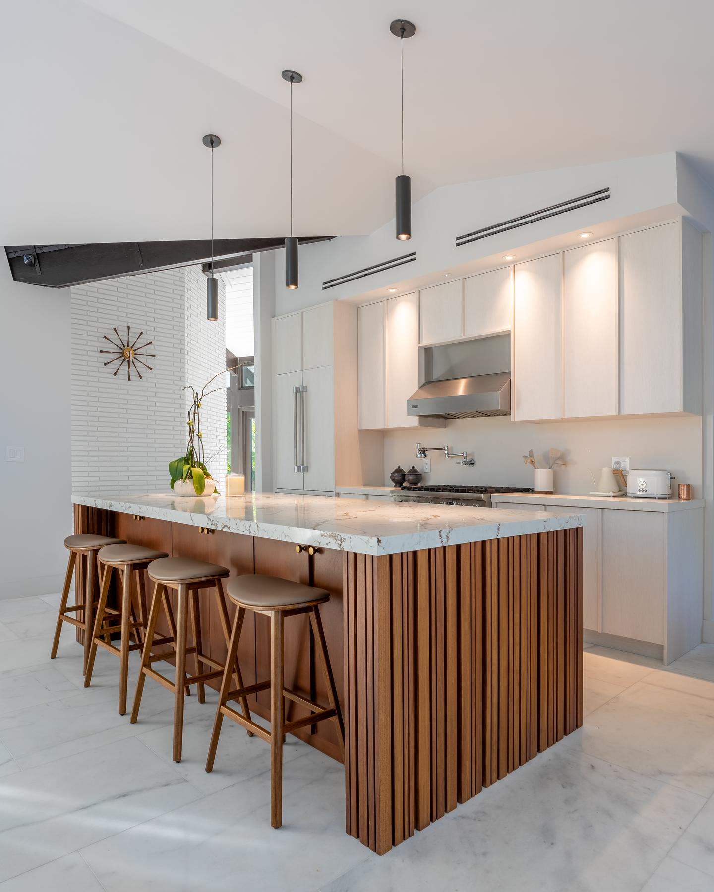 Chef's kitchen with marble island