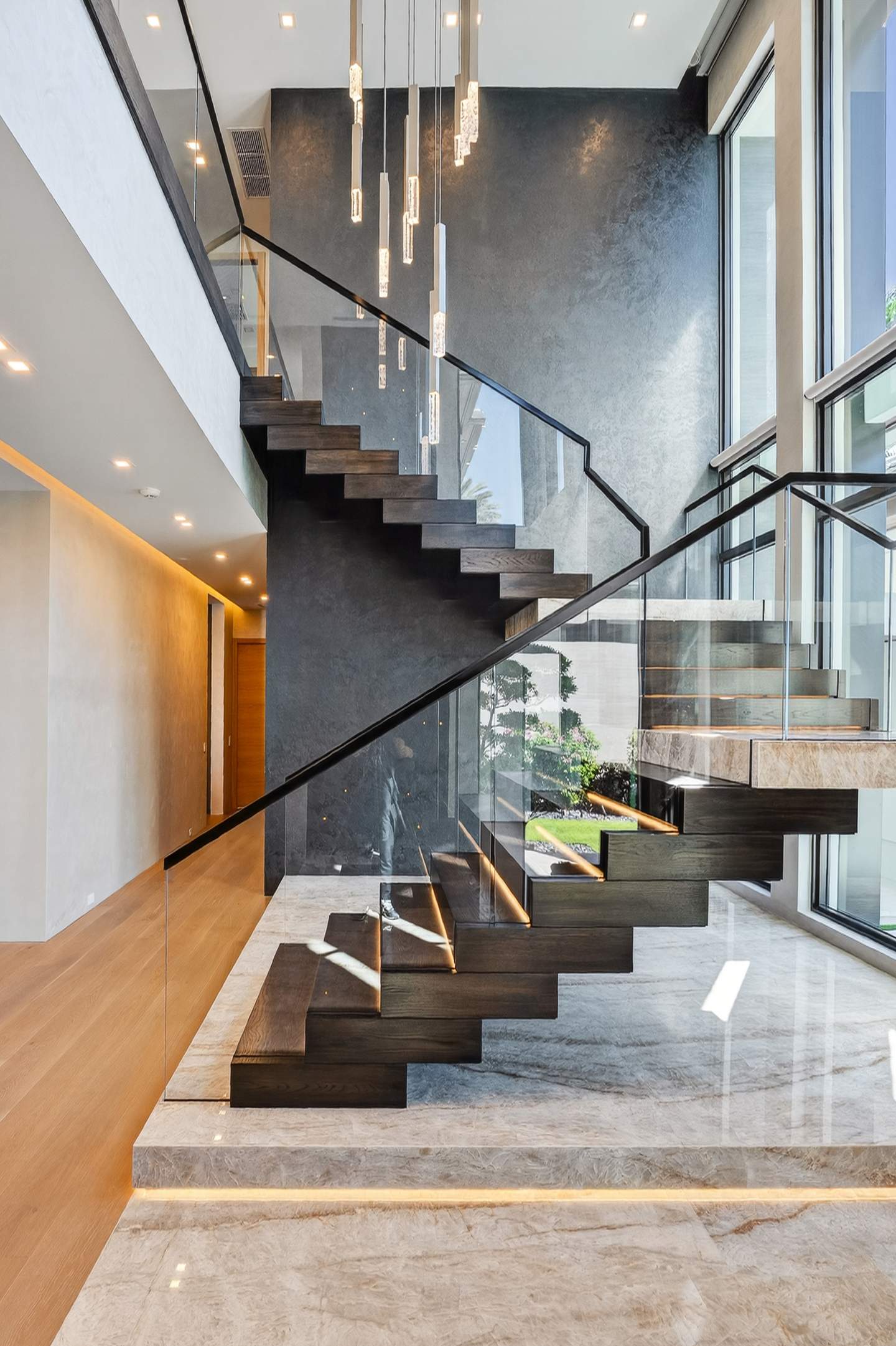 Grand stair with crystal pendants and marble landing