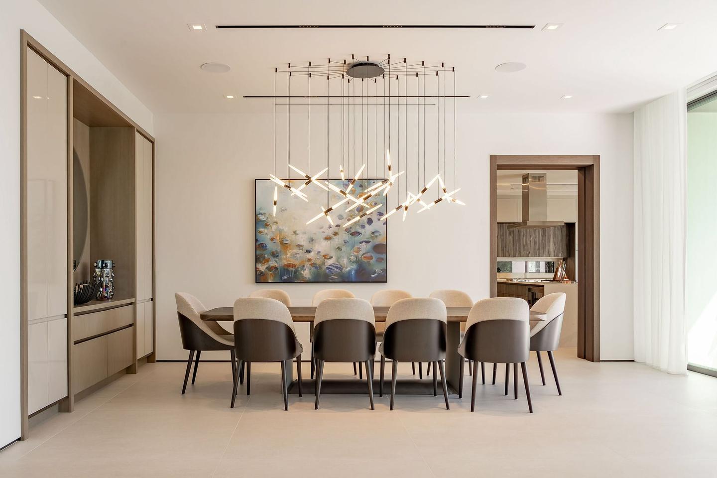 Luxury waterfront living room with floor-to-ceiling windows overlooking Biscayne Bay in Miami