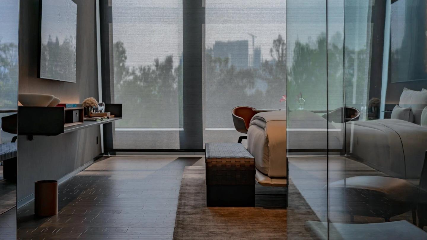 Hotel room interior with ocean view, professionally photographed to show spaciousness and luxury amenities