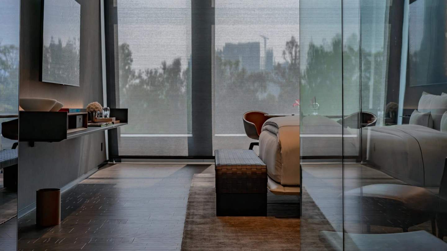 Hotel room interior with ocean view, professionally photographed to show spaciousness and luxury amenities