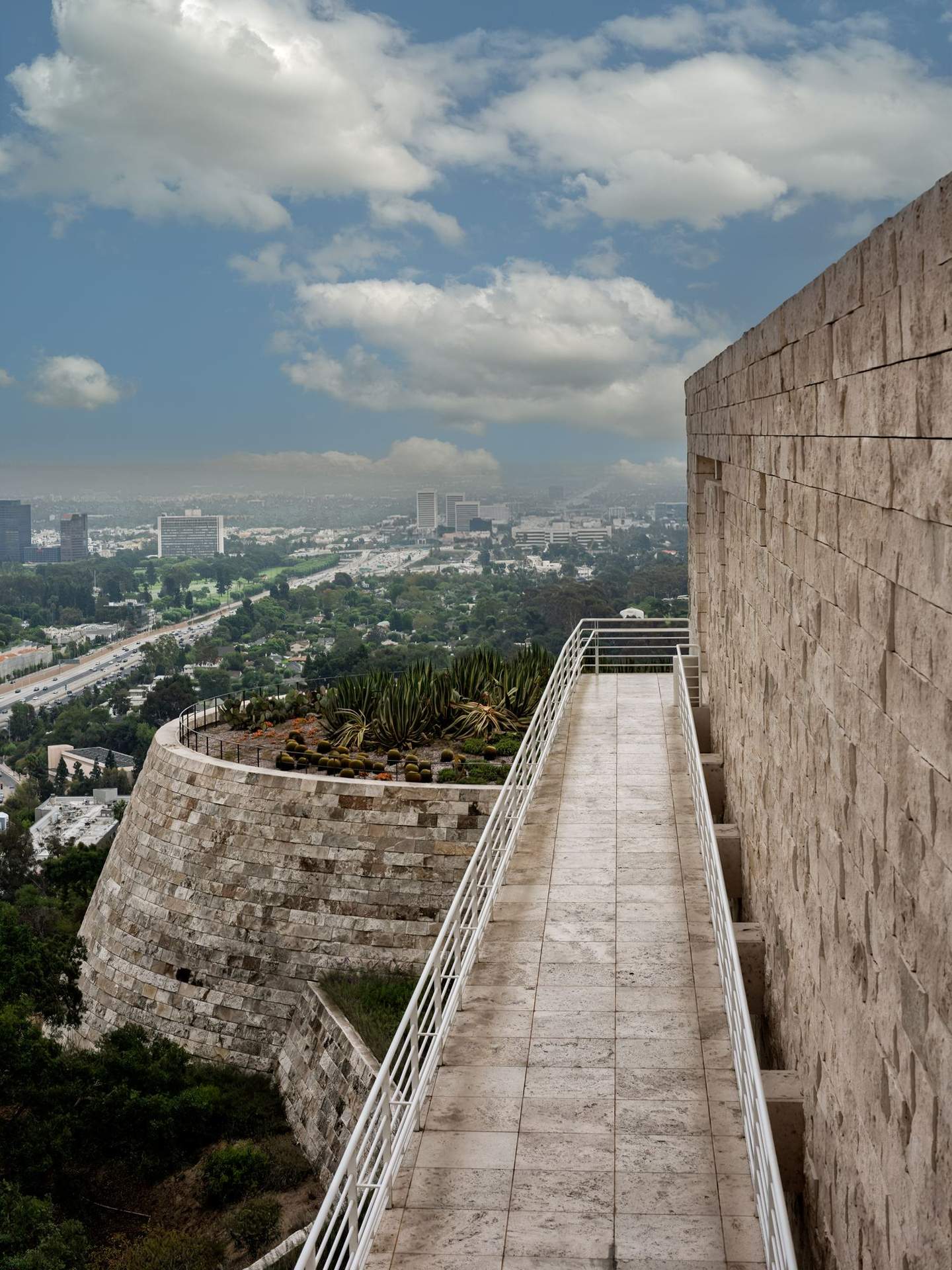 Getty Center south terrace looking east toward downtown Los Angeles, travertine cladding in foreground with city basin extending to the horizon