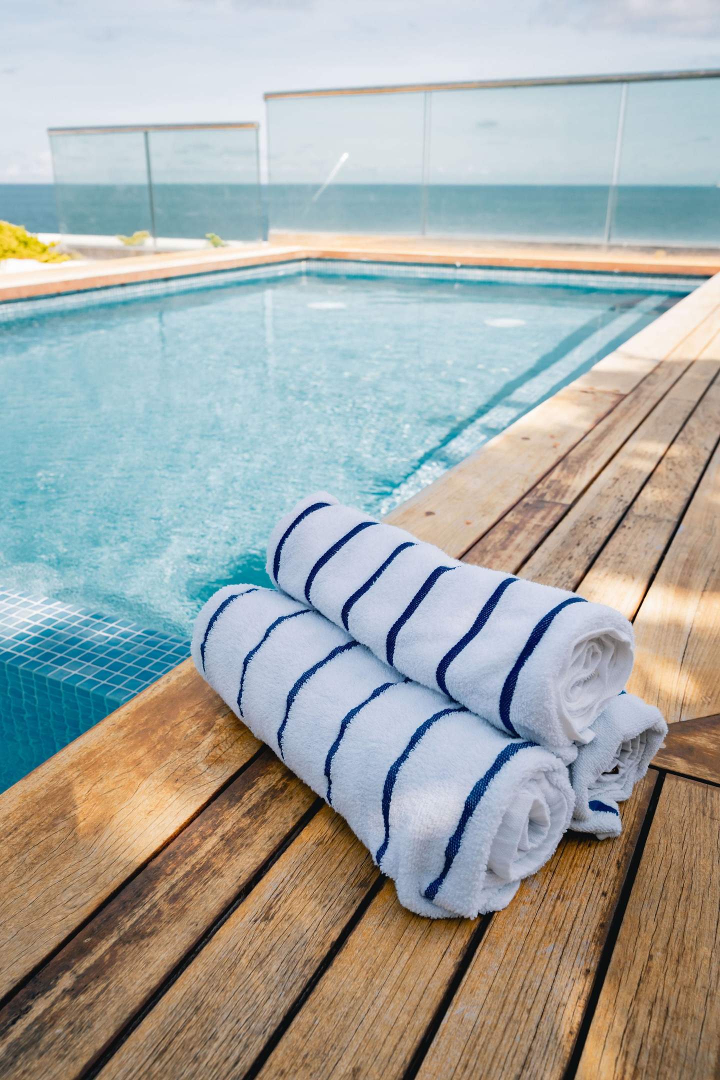 Poolside towels above the surf