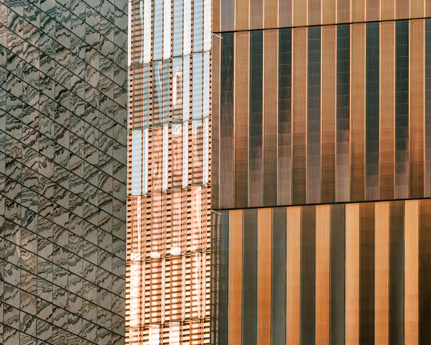 One World Trade Center, Lower Manhattan - Skidmore, Owings & Merrill, completed 2014. Detail of the tower's base where the square footprint begins its angular transition upward, faceted glass and steel panels creating a prismatic surface