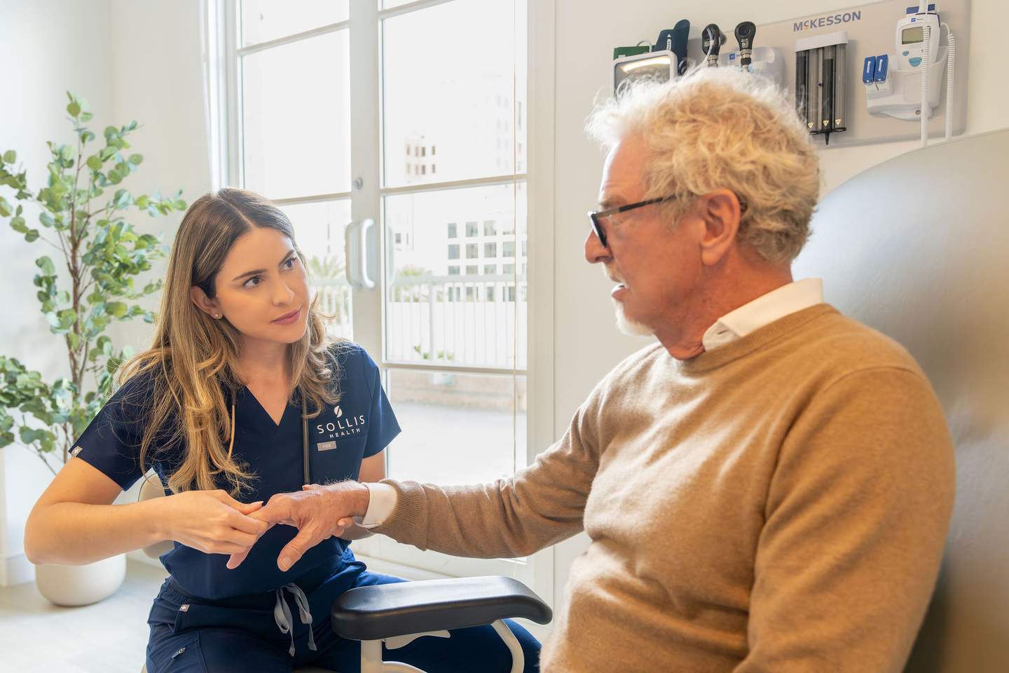 Clinician consulting with patient