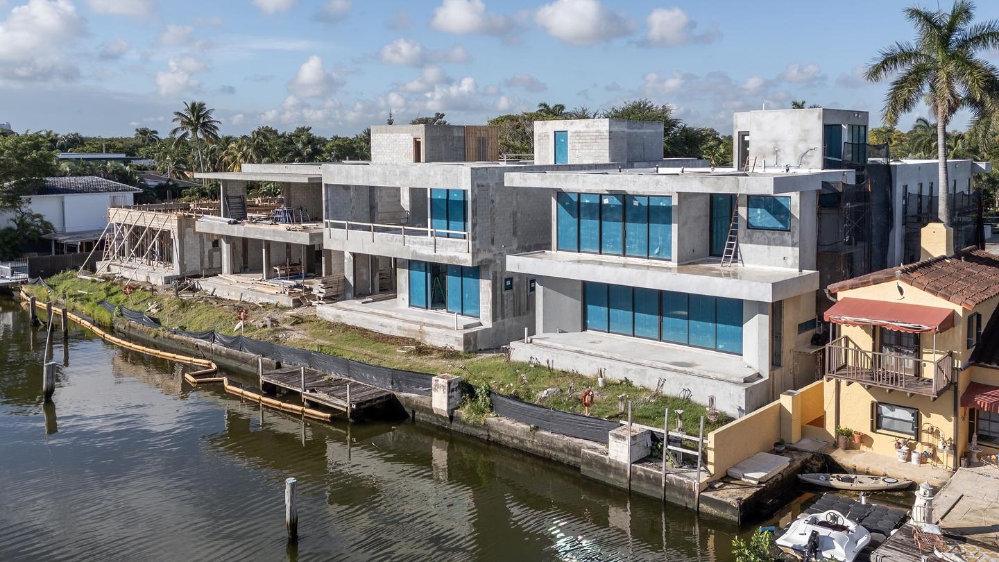 Aerial view — waterfront elevation mid-construction with glazing installed