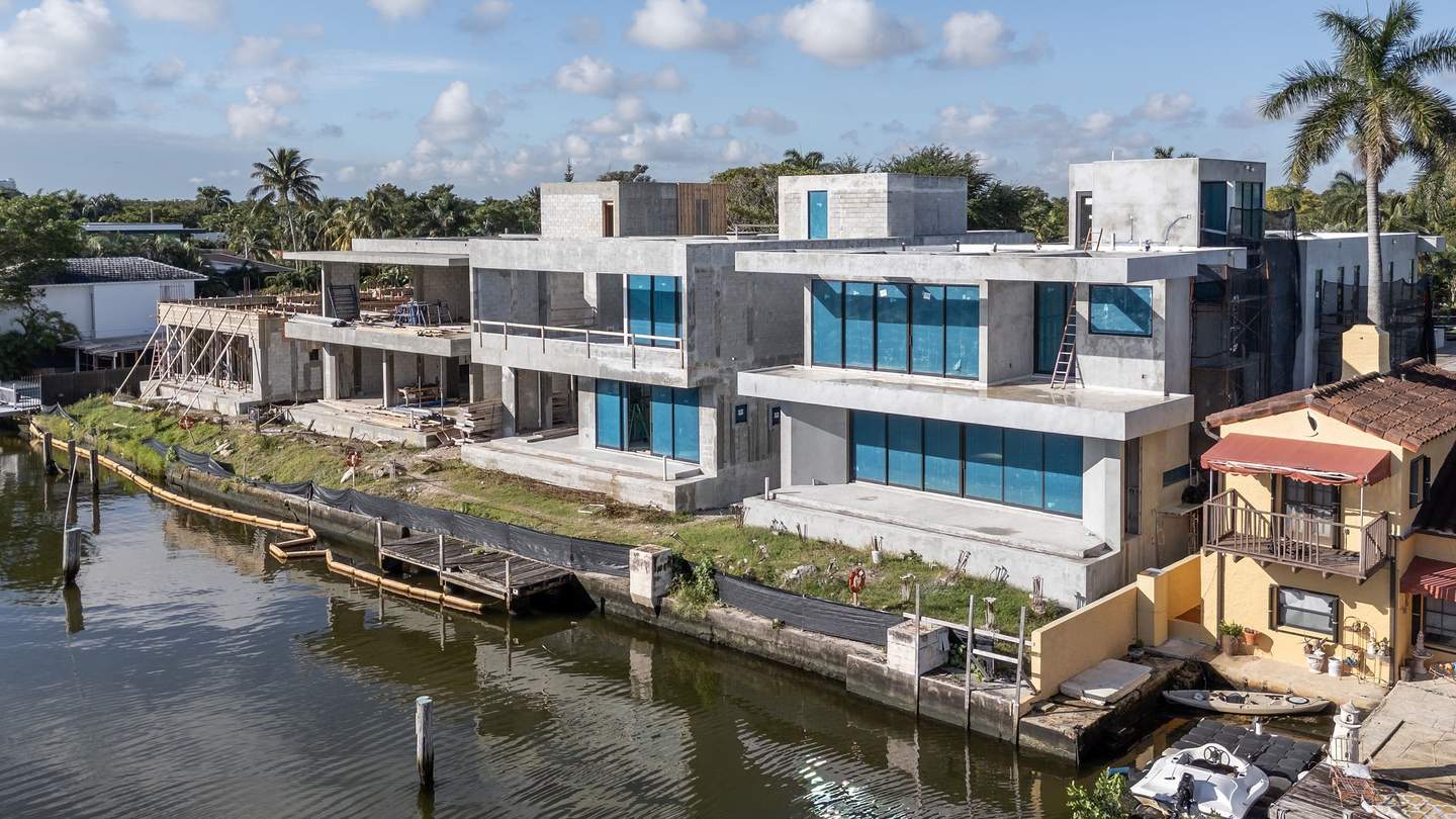 Aerial view — waterfront elevation mid-construction with glazing installed